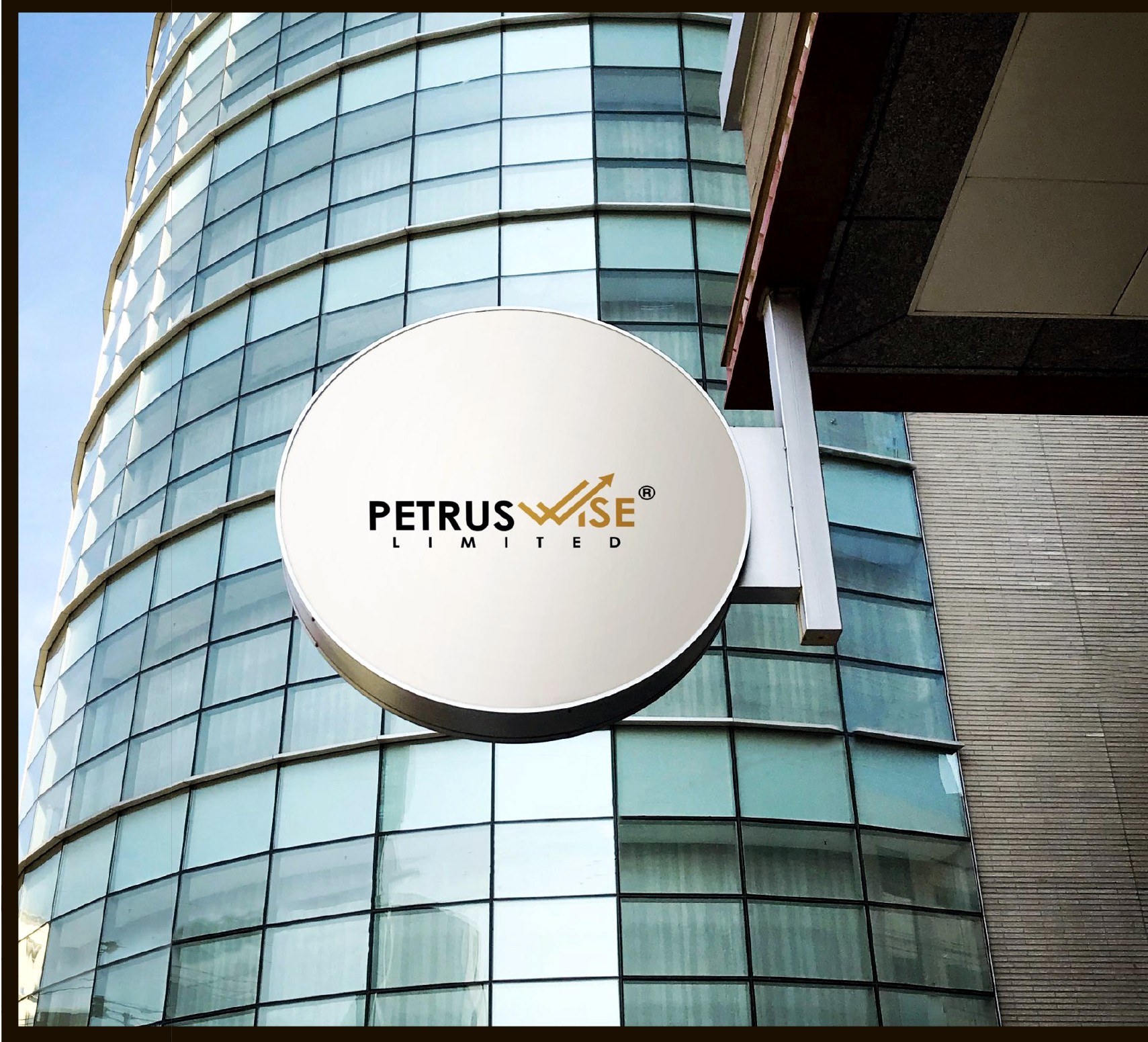 PetrusWise Limited branded building sign on a glass office facade